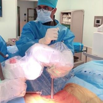 Guna Pratheep Kalanchiam and Jacob Yoong Leong Oh performing robotic assisted Lateral and Prone surgeries