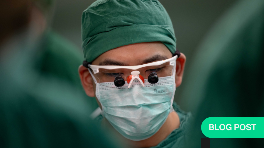 Close up on face of orthopaedic surgeon wearing surgical loupes